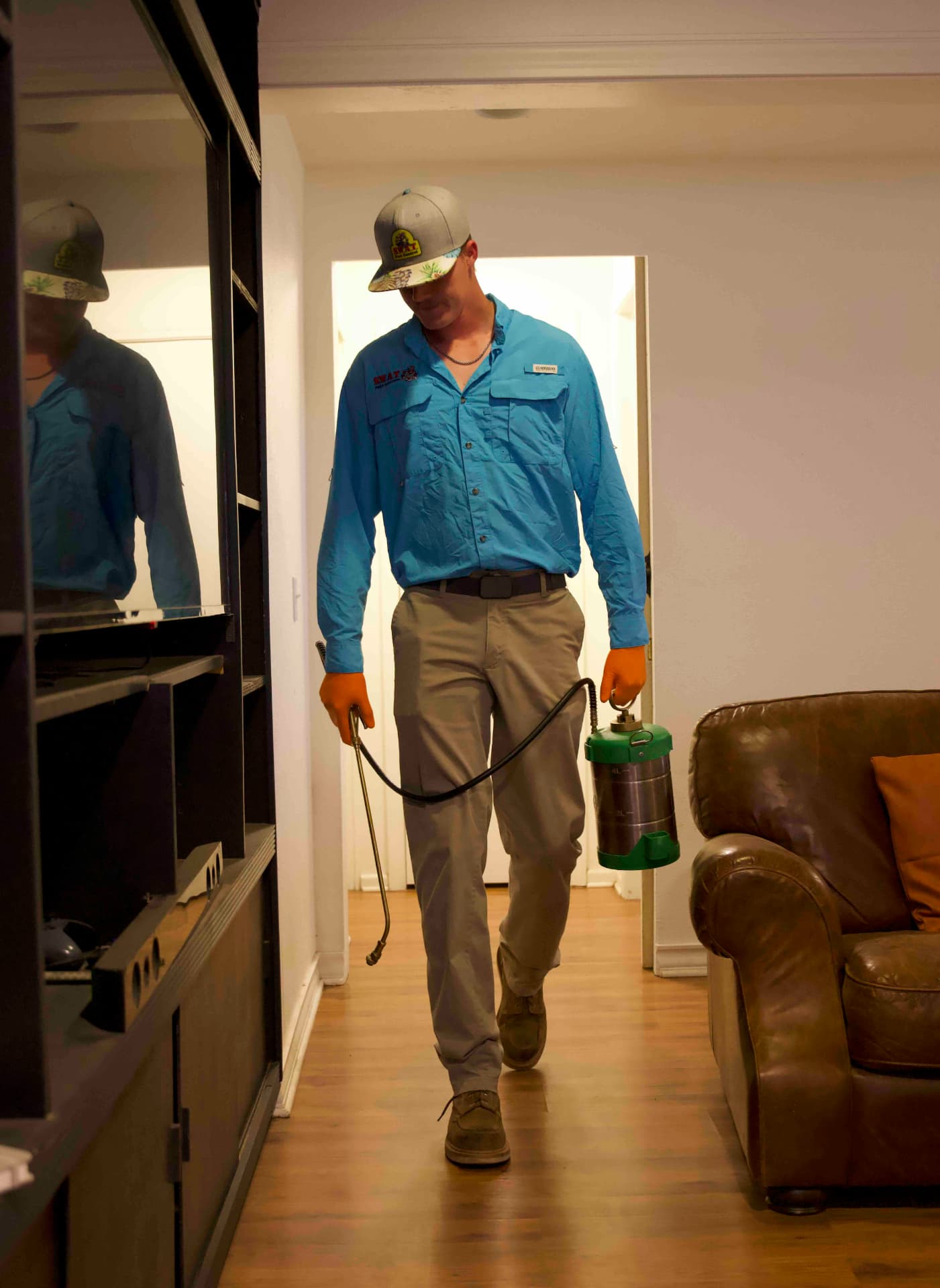 SWAT Pest Control technician treating the interior of a Lubbock home