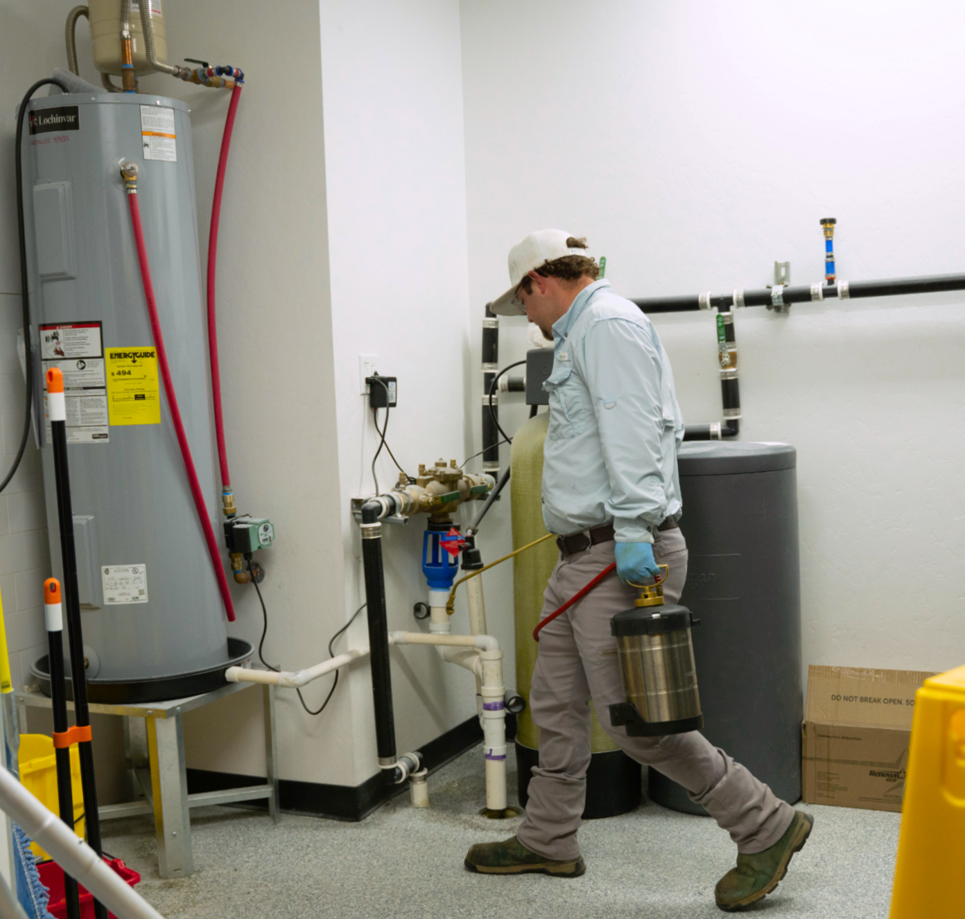 SWAT technician performing interior commercial pest treatment